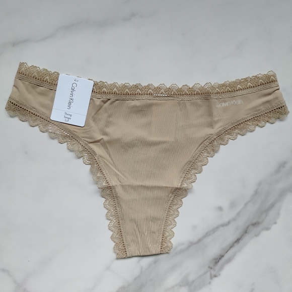 NWT CALVIN KLEIN FLIRTY MICRO THONG PANTY IN DESERT SIZE SMALL - Picture 1 of 5
